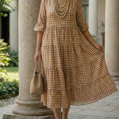 Brown polka dot tiered midi dress with short sleeves and tiered skirt hem