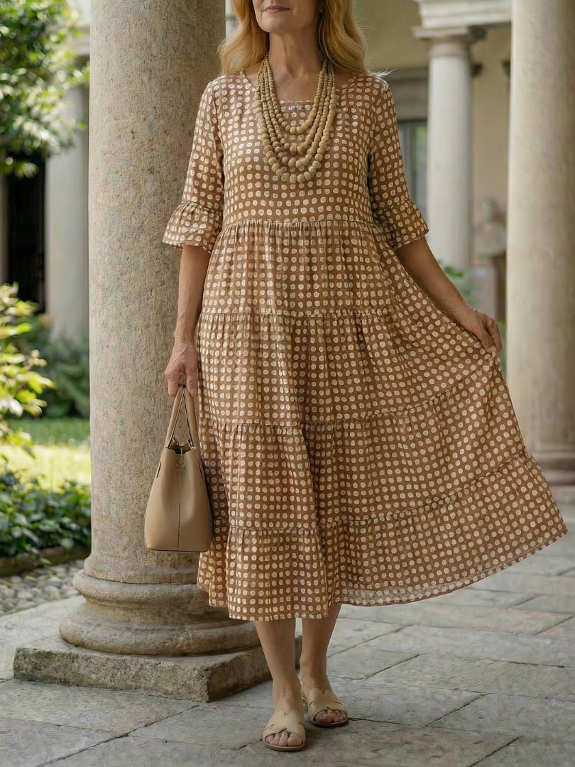 Brown polka dot tiered midi dress with short sleeves and tiered skirt hem