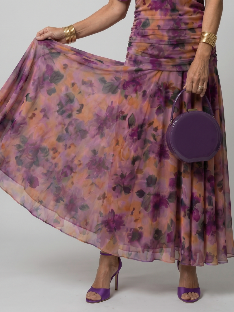 Off-shoulder maxi dress with purple and orange floral print, flowing chiffon skirt