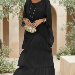 Carbon black tiered long-sleeve dress with draped overlay and round neckline