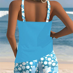 Belly-covering swim set, light blue racerback tank and blue floral patterned swim shorts, back view