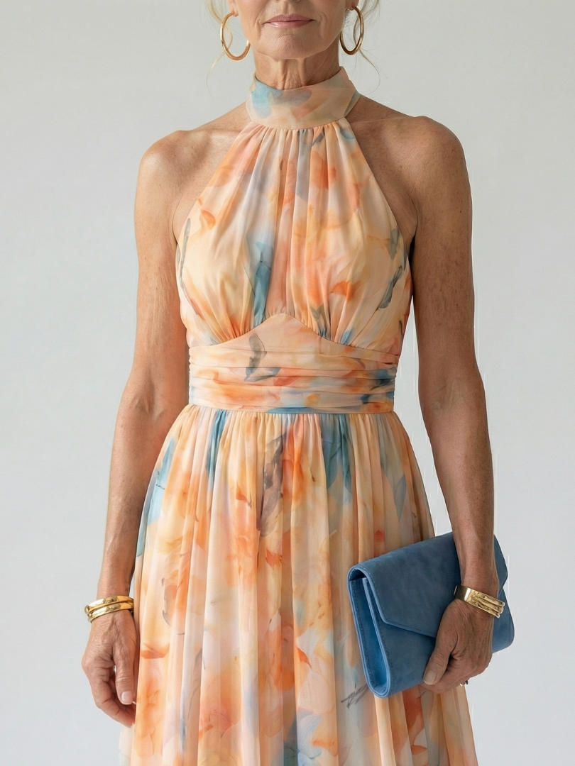 Watercolor orange-and-blue halter midi dress with gathered waist and sleeveless bodice