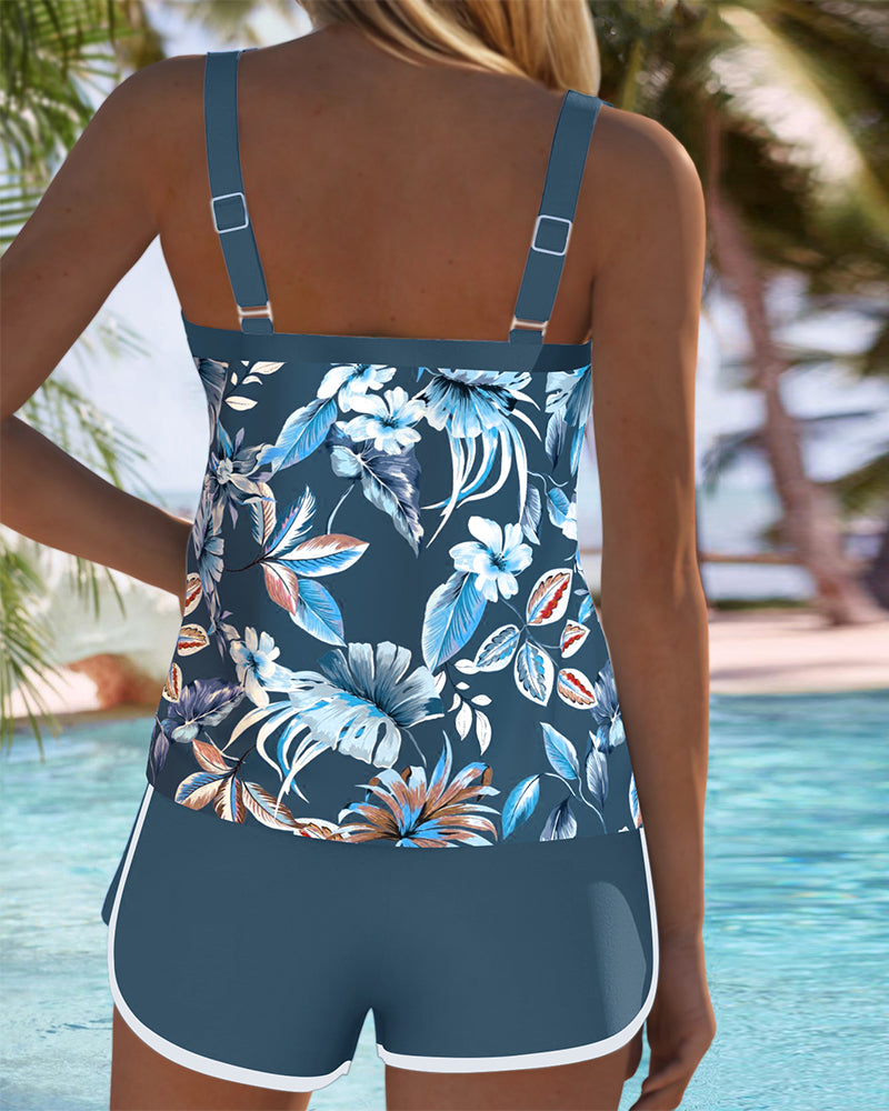 Royal blue tropical floral tankini back view with adjustable straps and white trim