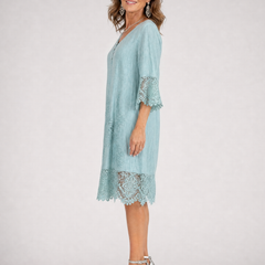 Light blue shift midi dress with short sleeves and lace-trimmed hem panel