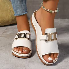 White open-toe sandals with single front strap, gold-tone buckle, and flat sole