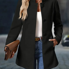 Black button-up tailored coat with notch lapels, rounded buttons, and side pockets