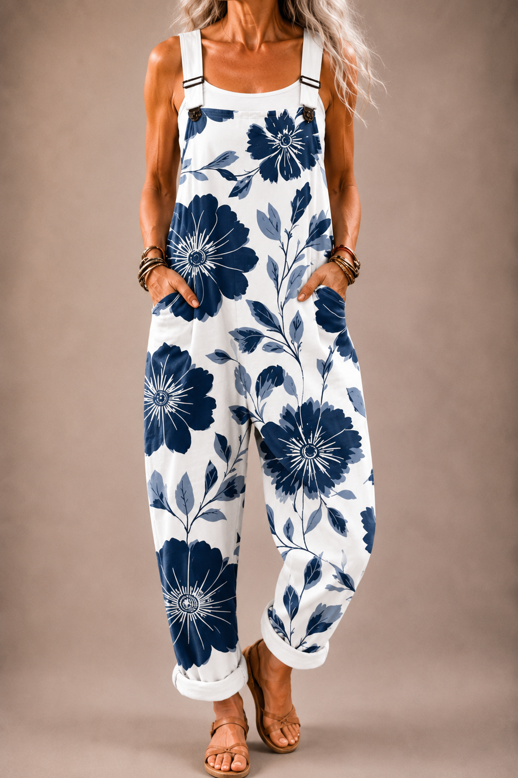 Floral-print cotton overalls with adjustable straps, white base and navy flowers