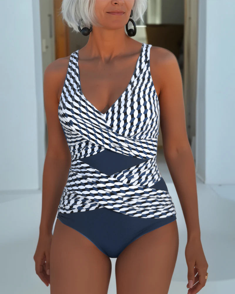 Women's cross-over swimsuit, white with dark geometric print and navy bottom