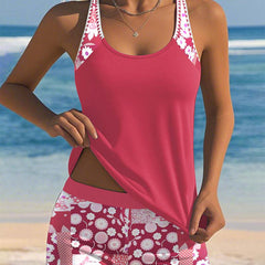 Pink/red two-piece swimwear set with patterned shorts; scoop-neck tank with contrast straps.