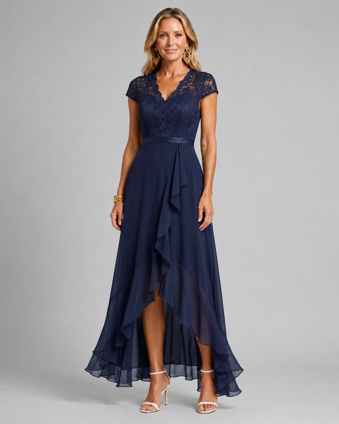 Navy blue lace evening dress with cap sleeves, fitted waist, and asymmetrical ruffle hem