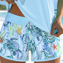 Light blue ocean-print swim shorts with drawstring tie and sea turtle and starfish