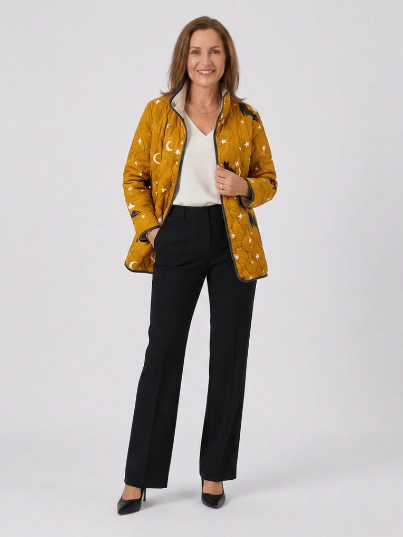 Quilted cat-themed Halloween jacket, mustard orange with star and cat print, zip front