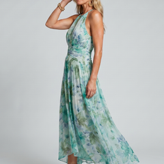 Green floral halter midi dress with keyhole neckline detail and flowing pleats
