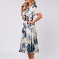 Floral wrap midi dress in blue and gold with V-neck and short sleeves, side view