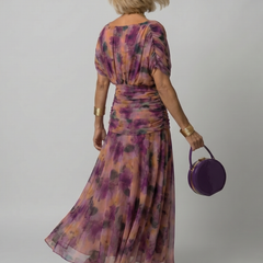 Off-shoulder maxi dress in purple floral print, gathered back and flowing skirt