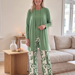 Green three-piece set: tunic top, matching cardigan, leaf-print wide-leg pants