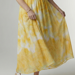 Yellow gathered halter midi dress detail view with smocked bodice and tiered skirt