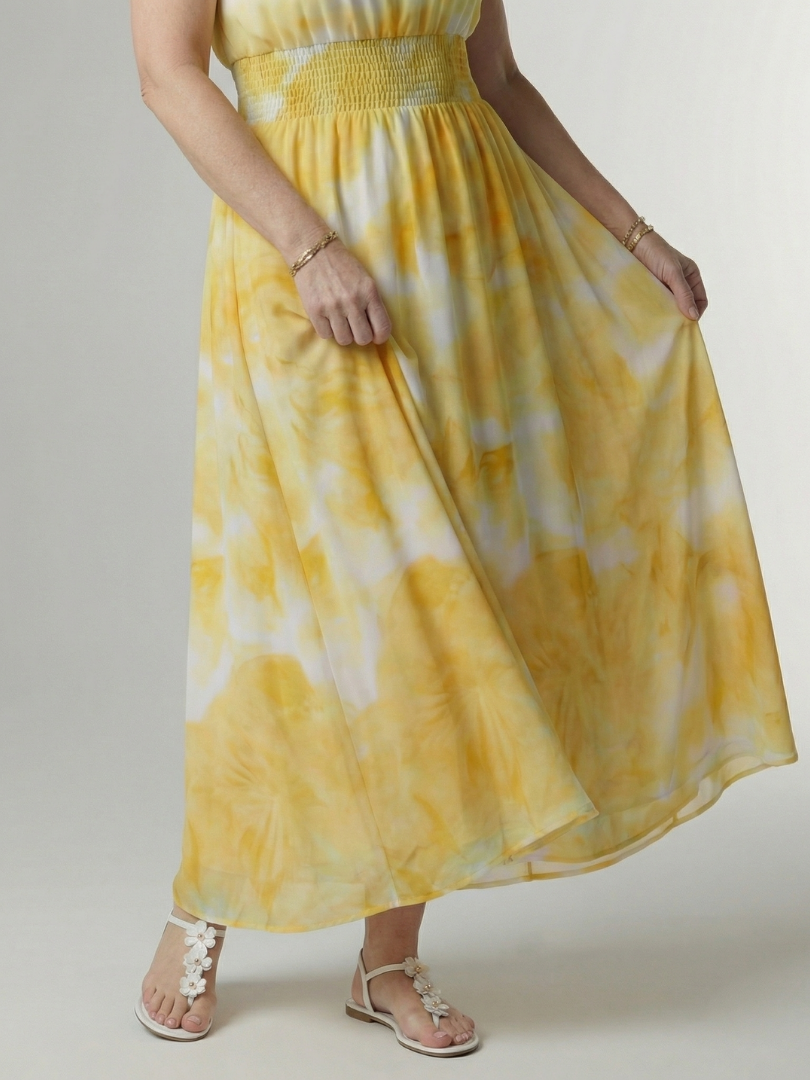 Yellow gathered halter midi dress detail view with smocked bodice and tiered skirt