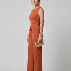 Rust-orange sleeveless top and wide-leg pants set with tied drawstring waist