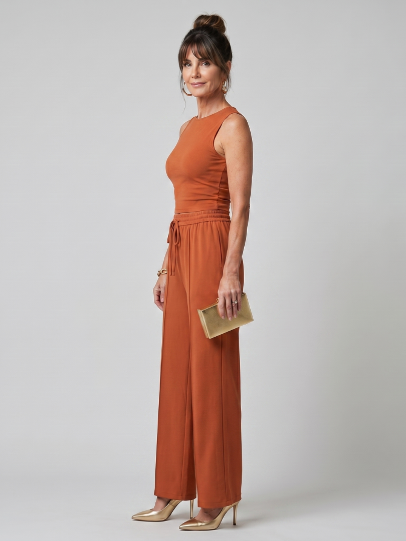 Rust-orange sleeveless top and wide-leg pants set with tied drawstring waist