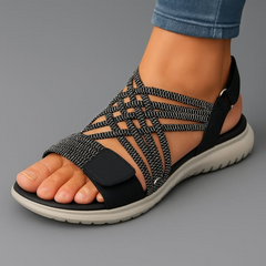 Black woven strappy sandals with crisscross upper and hook-and-loop heel strap