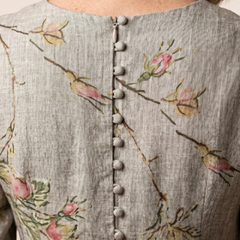 Floral relaxed dress back view with V-neck, button placket, and multicolor branch print