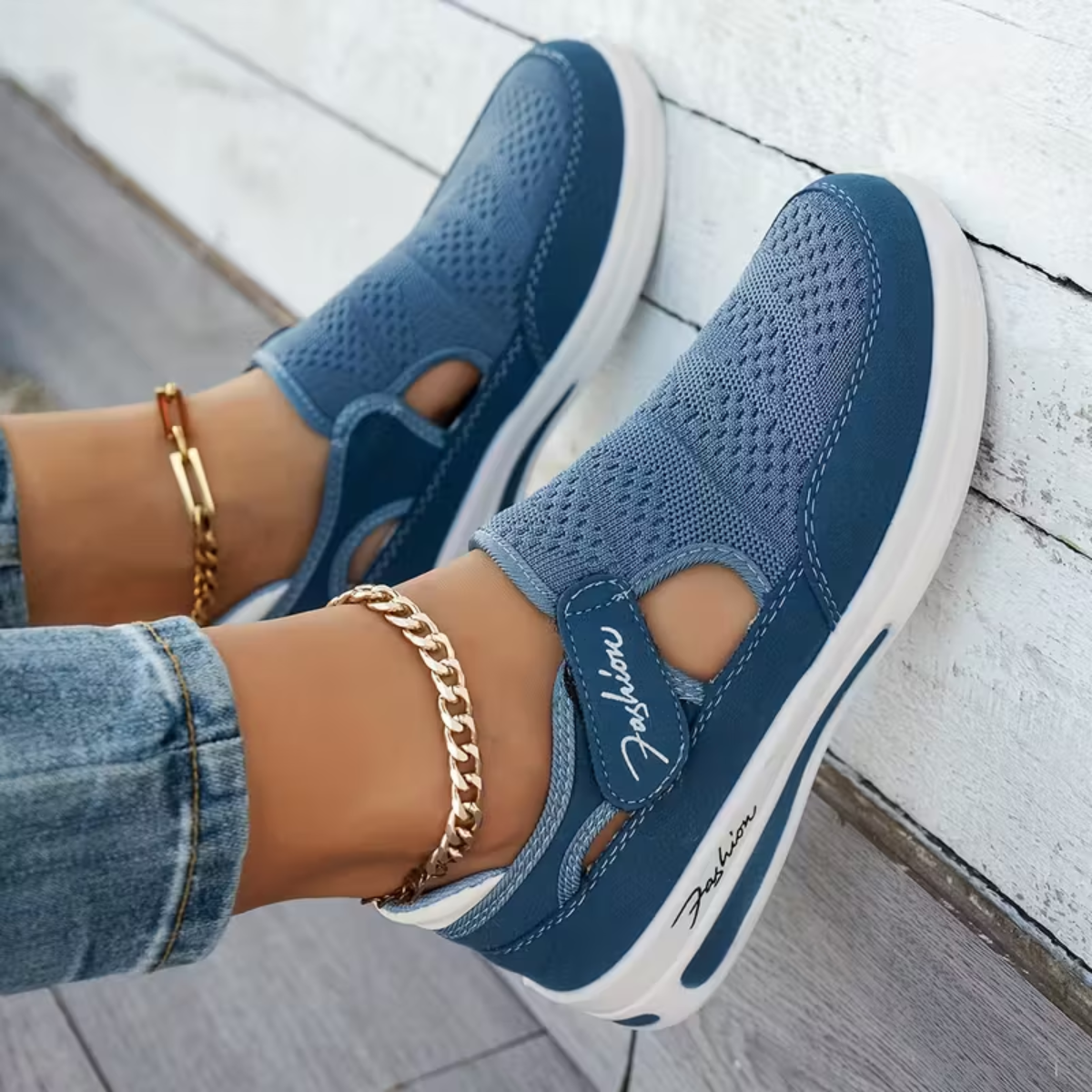 Blue perforated comfort sneakers with elastic strap and white rubber sole