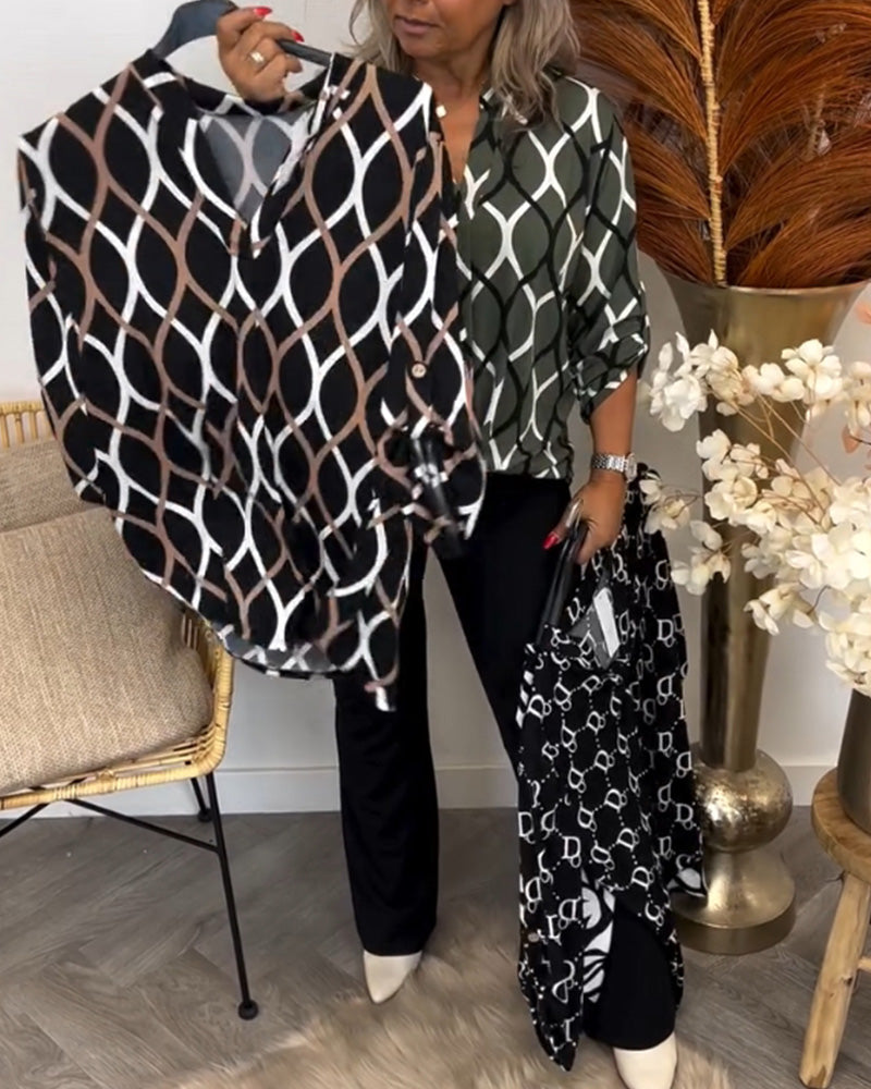 Navy blouse with white linked oval pattern and roll-cuff sleeves, button front