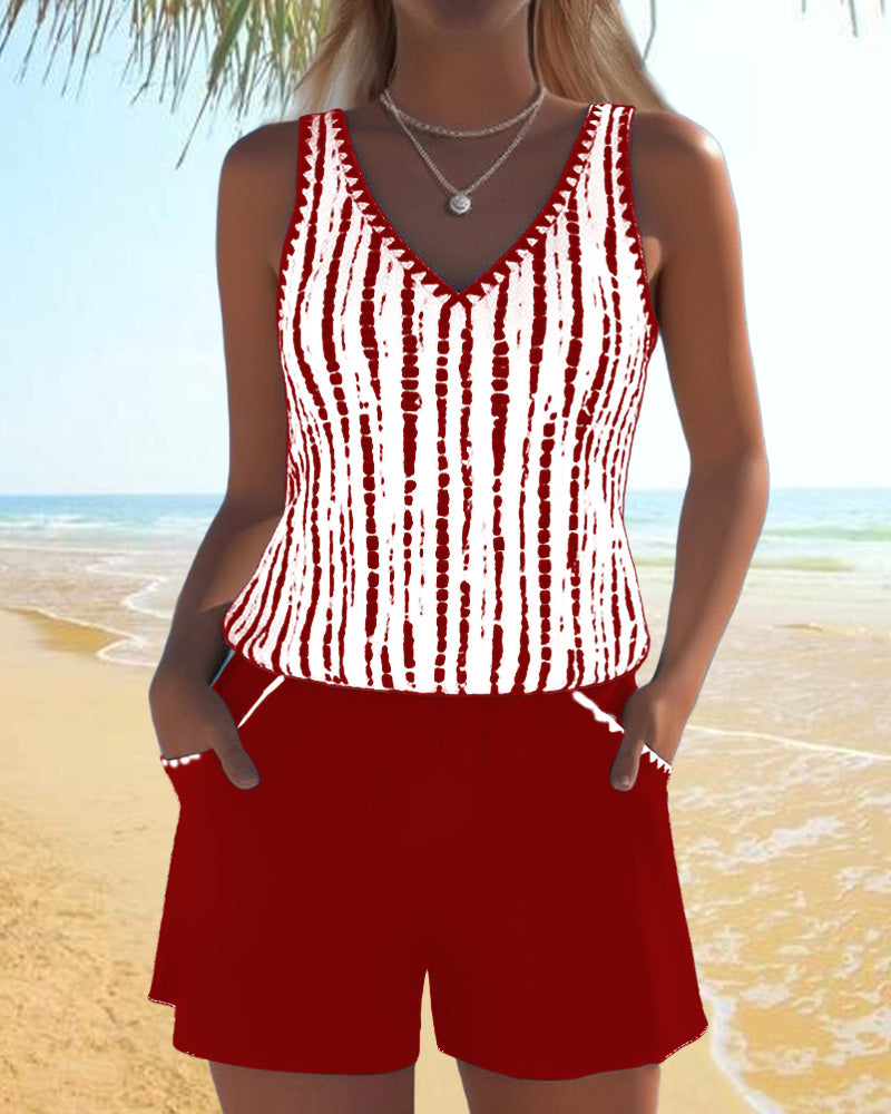Red two-piece V-neck swimsuit set with white vertical tie-dye stripe tank and shorts