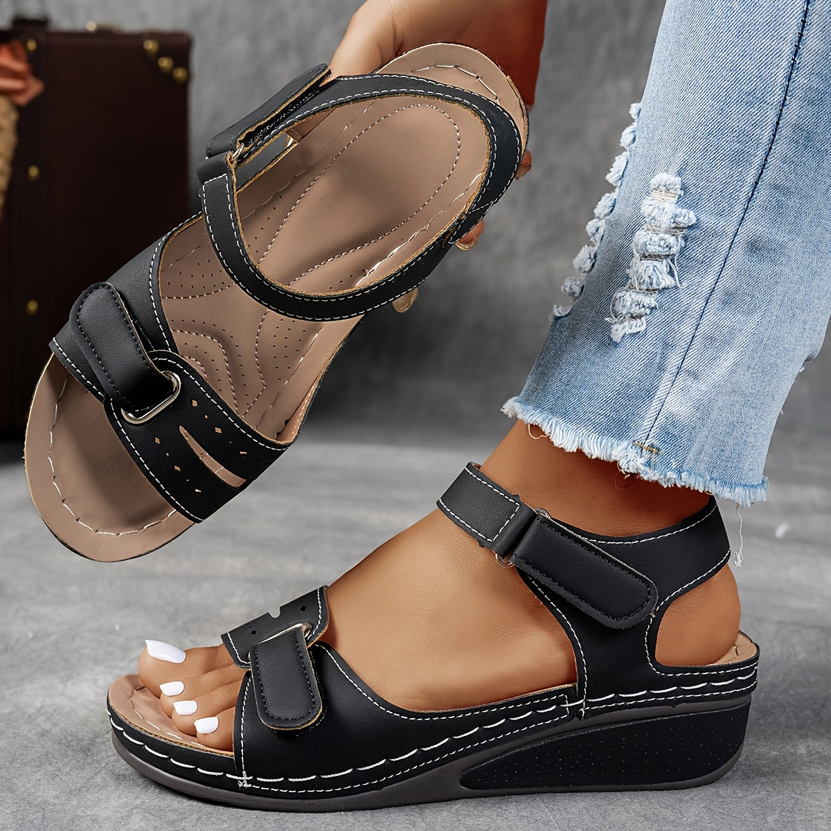 Black leather open-toe sandals with two hook-and-loop straps and stitched platform sole