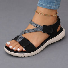 Black open-toe sandals with two hook-and-loop straps, ankle chain, cushioned sole