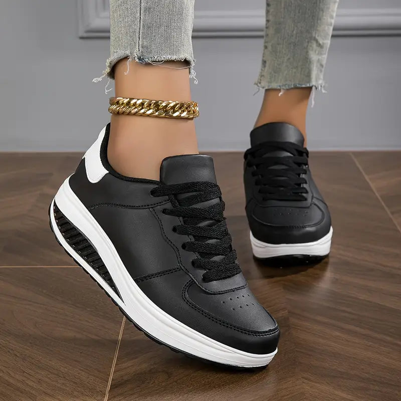 Black platform comfort sneakers with white midsole and lace-up detailing