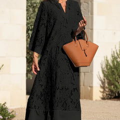 Onyx black lace midi dress with V-neck and lace overlay pattern, relaxed A-line fit