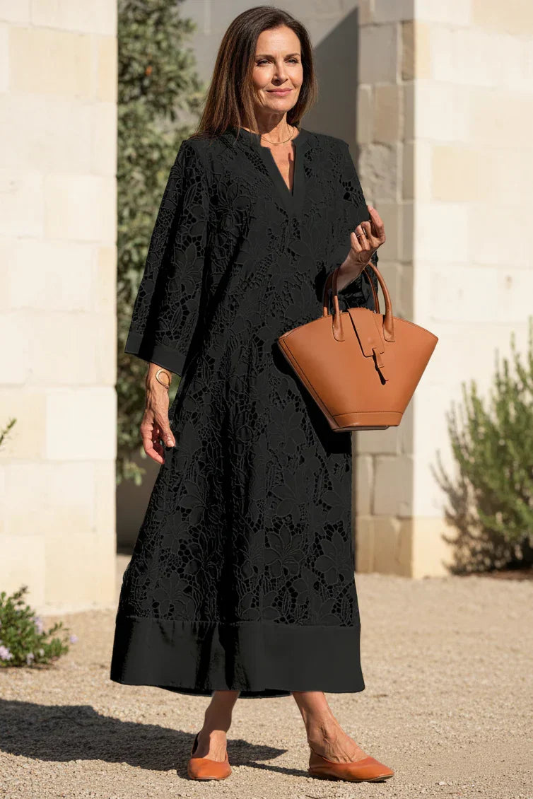 Onyx black lace midi dress with V-neck and lace overlay pattern, relaxed A-line fit