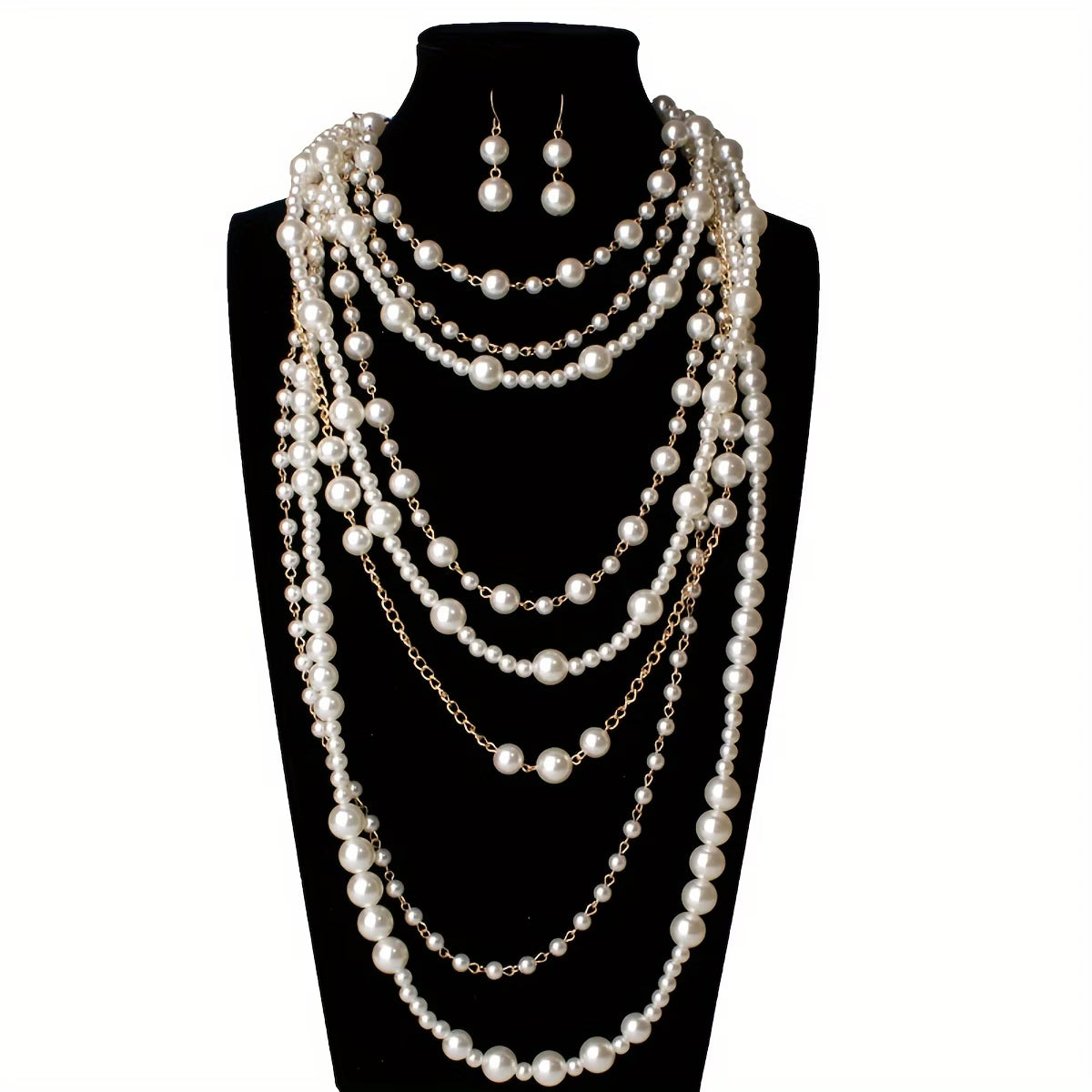 Pearl statement necklace with multi-strand drape and matching earrings on mannequin