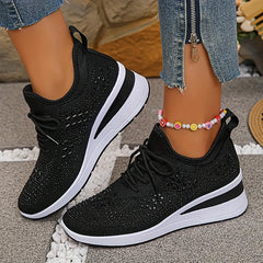 Black knit comfort sneakers with lace-up closure, rhinestone upper, and white sole