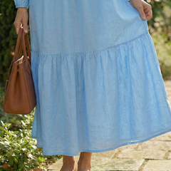Light blue tiered dress skirt with gathered ruffle hem and long sleeves