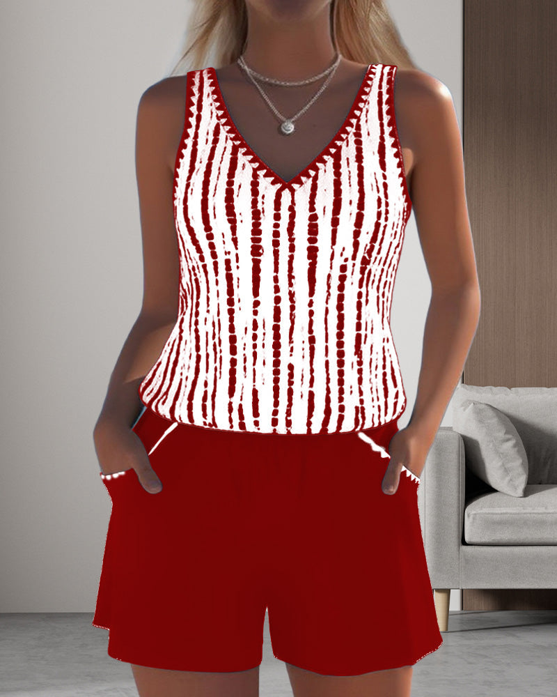 Red two-piece V-neck swimsuit set with white vertical tie-dye stripe tank and shorts