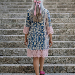 Floral vintage garden dress back view with ribbon tie and pink lace hem