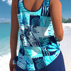 Blue tankini top with scoop back and tropical palm print, with swim shorts