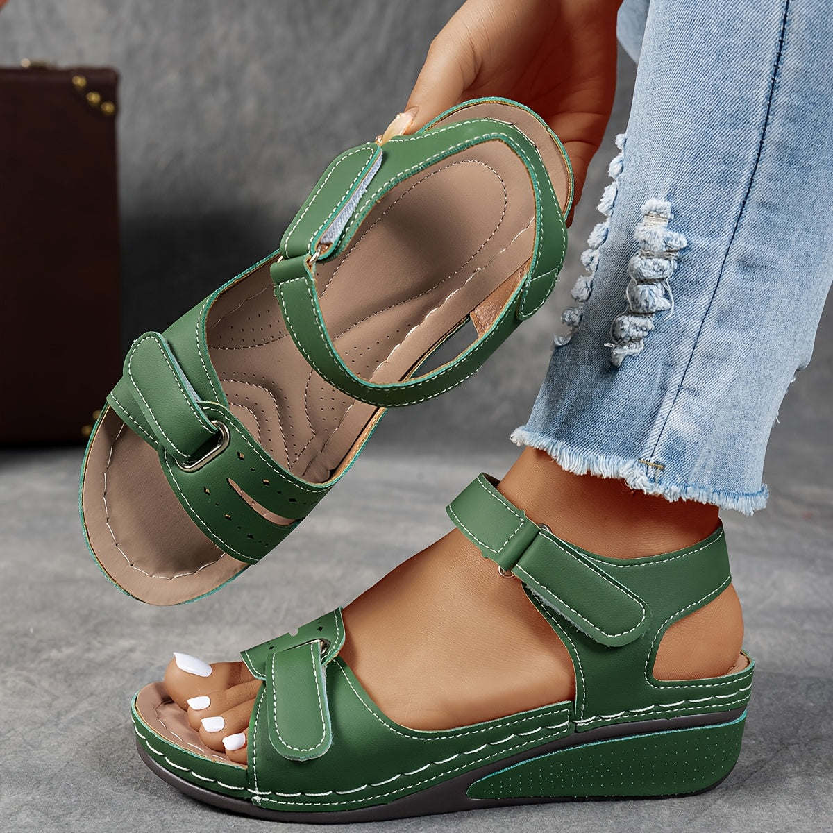 Green leather open-toe sandals with two hook-and-loop straps and cushioned platform sole
