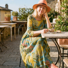 Painterly canvas midi dress in teal/yellow/coral, seated, relaxed loose fit