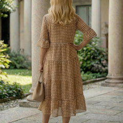 Brown polka dot tiered midi dress back view with short sleeves and tiered hem