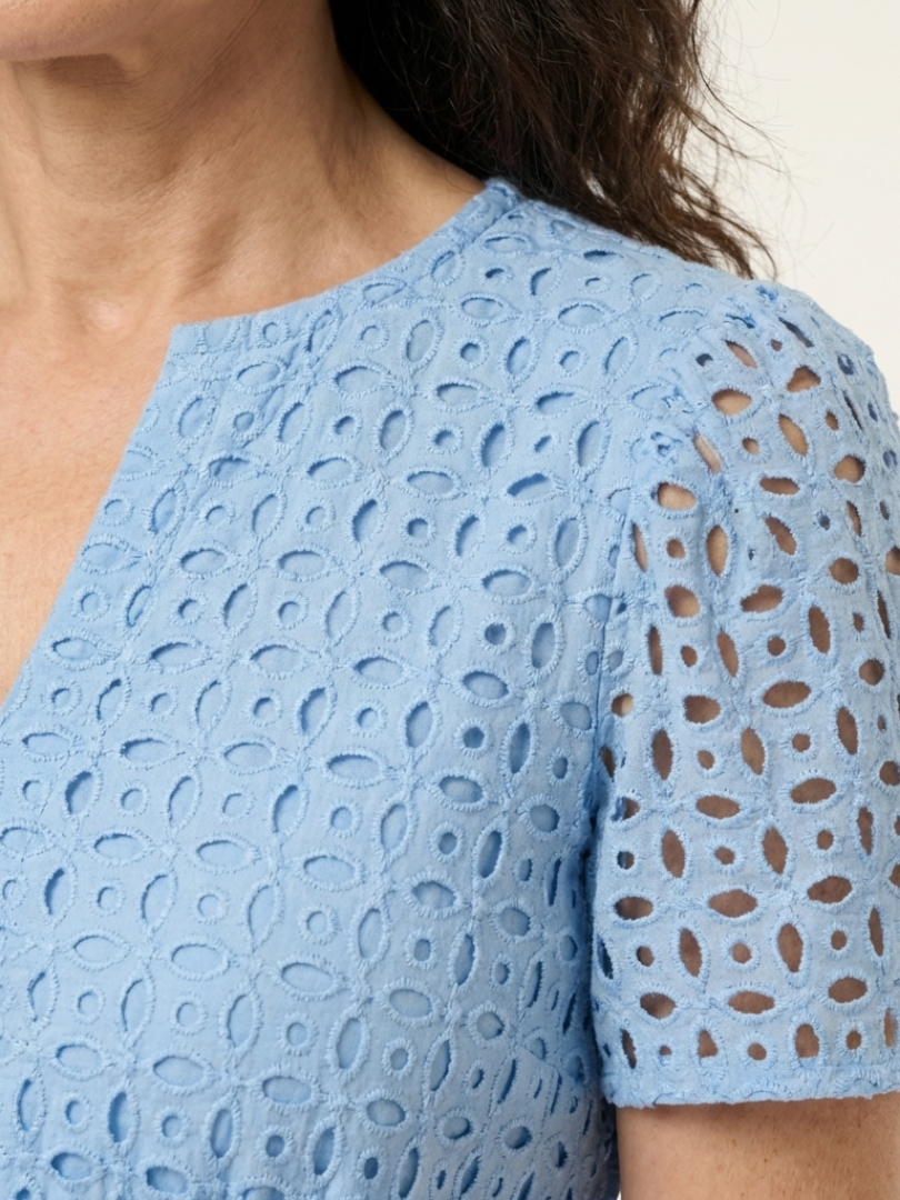 Sky blue short sleeve with cutout shoulder detail on textured eyelet fabric