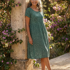 Meadow Drift dress in green with white tiny dots, short sleeves, knee-length fit-and-flare