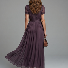 Purple keyhole maxi dress with puff sleeves, gathered waist, and flared pleated skirt