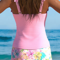 Pink tankini set back view with ruched tank top and ruffle straps, floral skirt