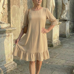 Beige ruffle day dress with tiered skirt and three-quarter puff sleeves