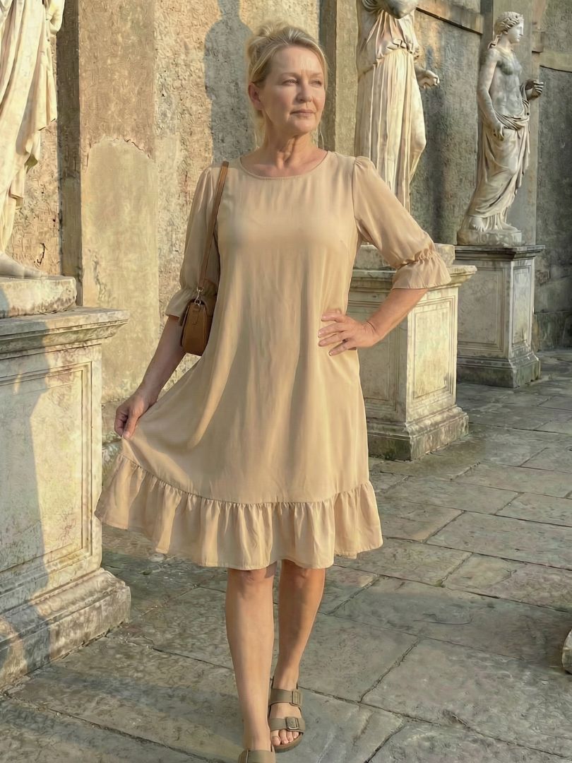 Beige ruffle day dress with tiered skirt and three-quarter puff sleeves