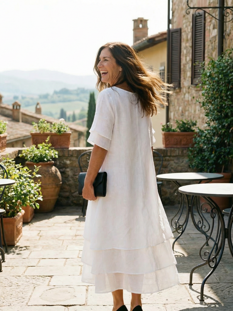 White soft layered midi dress with short sleeves and tiered skirt